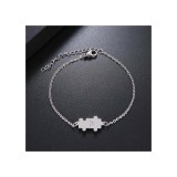 AZIZ Nemesacél puzzle motívumos állítható méretű női karkötő, ezüst színű