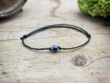 Kék amulett pöttöm fekete karkötő
