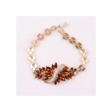 Maria King Arany színű karkötő - barna kristályokkal