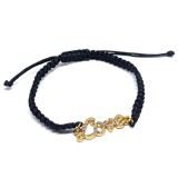 Maria King Arany színű kristályos Love feliratos makramé karkötő