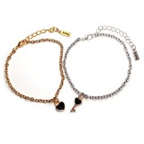 Maria King Ezüst-arany színű páros karkötő fekete szív és fekete kulcs charmmal