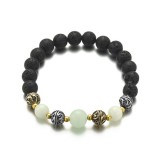 Maria King Lávakő karkötő fémdíszekkel, sötétben zölden világító gyöngyökkel