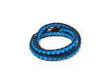 R.M.ékszer Jáde szin kék golyó 6mm bőrrel font kari 58cm