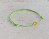 Világoszöld nanocord karkötő apró sárga roppantott üveggyönggyel
